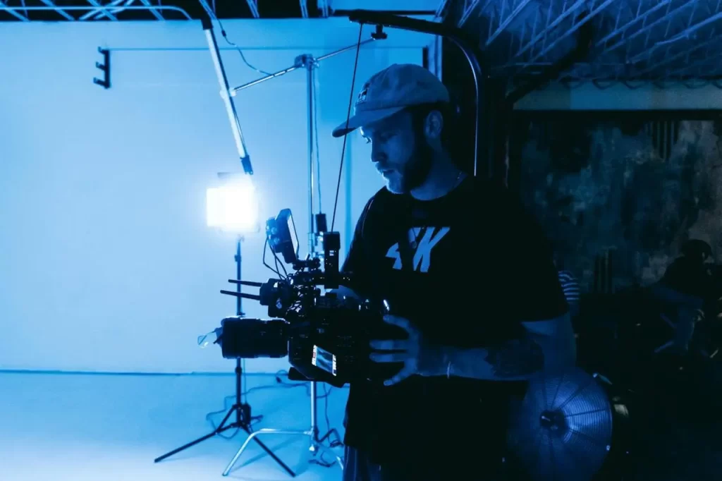 In a virtual production studio, a poised broadcast technician adeptly operating a camera.